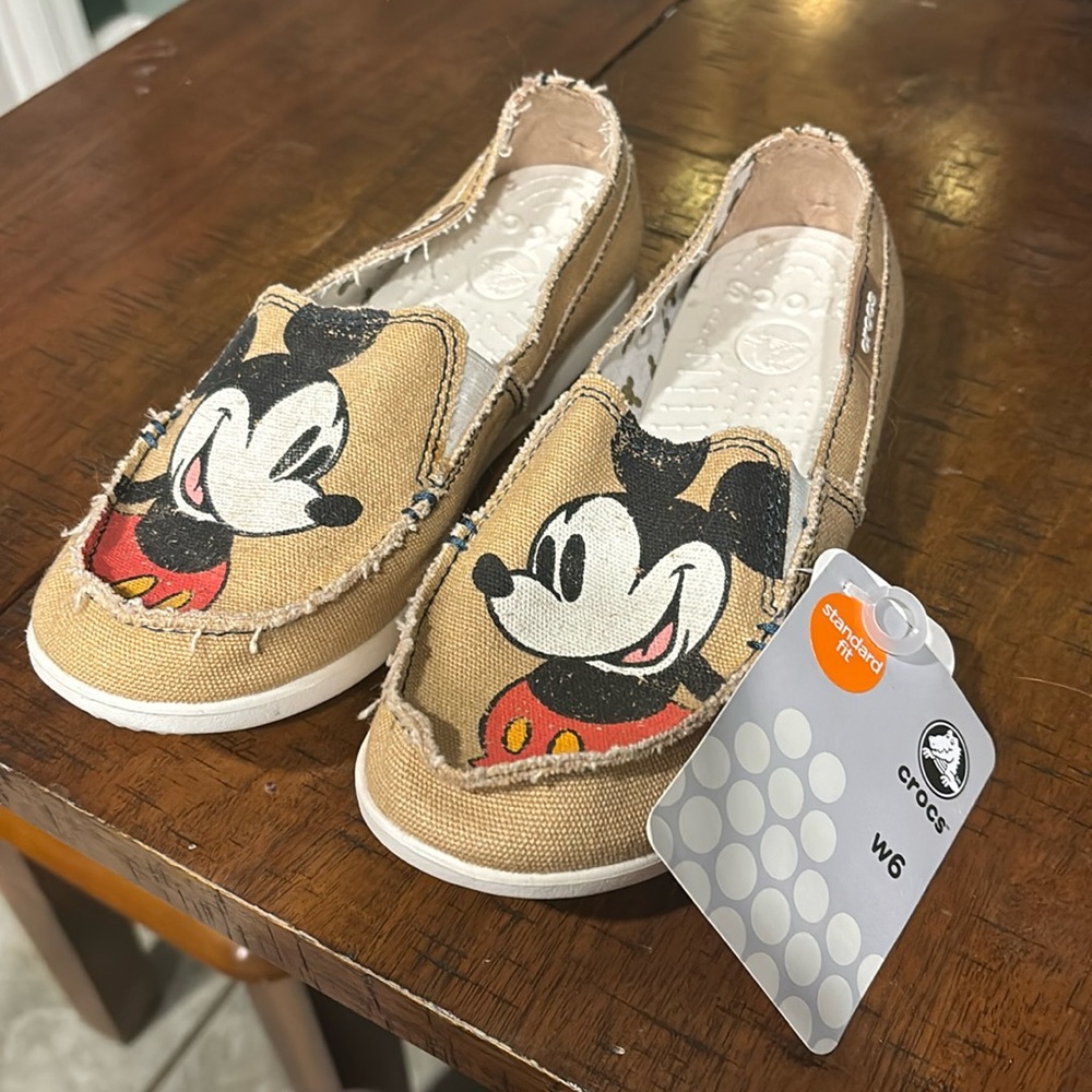 New with tag crocs canvas Mickey shoes. Ladies size 6.
